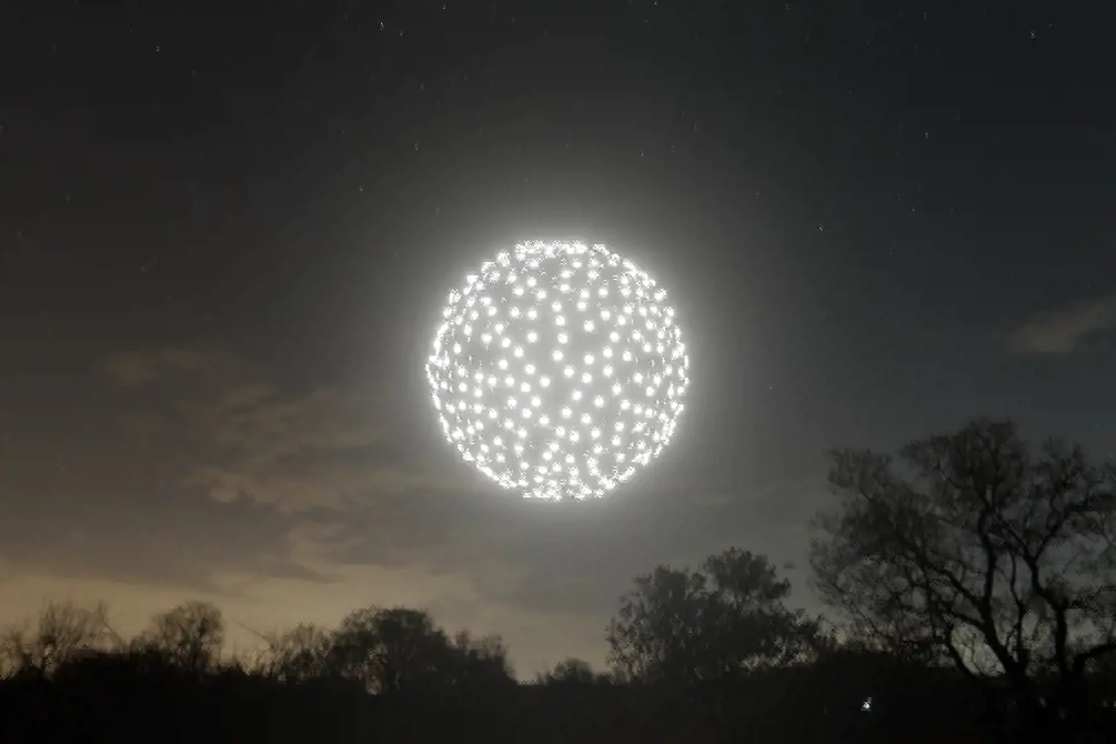 Rendering of a generated UAV formation with a night sky background